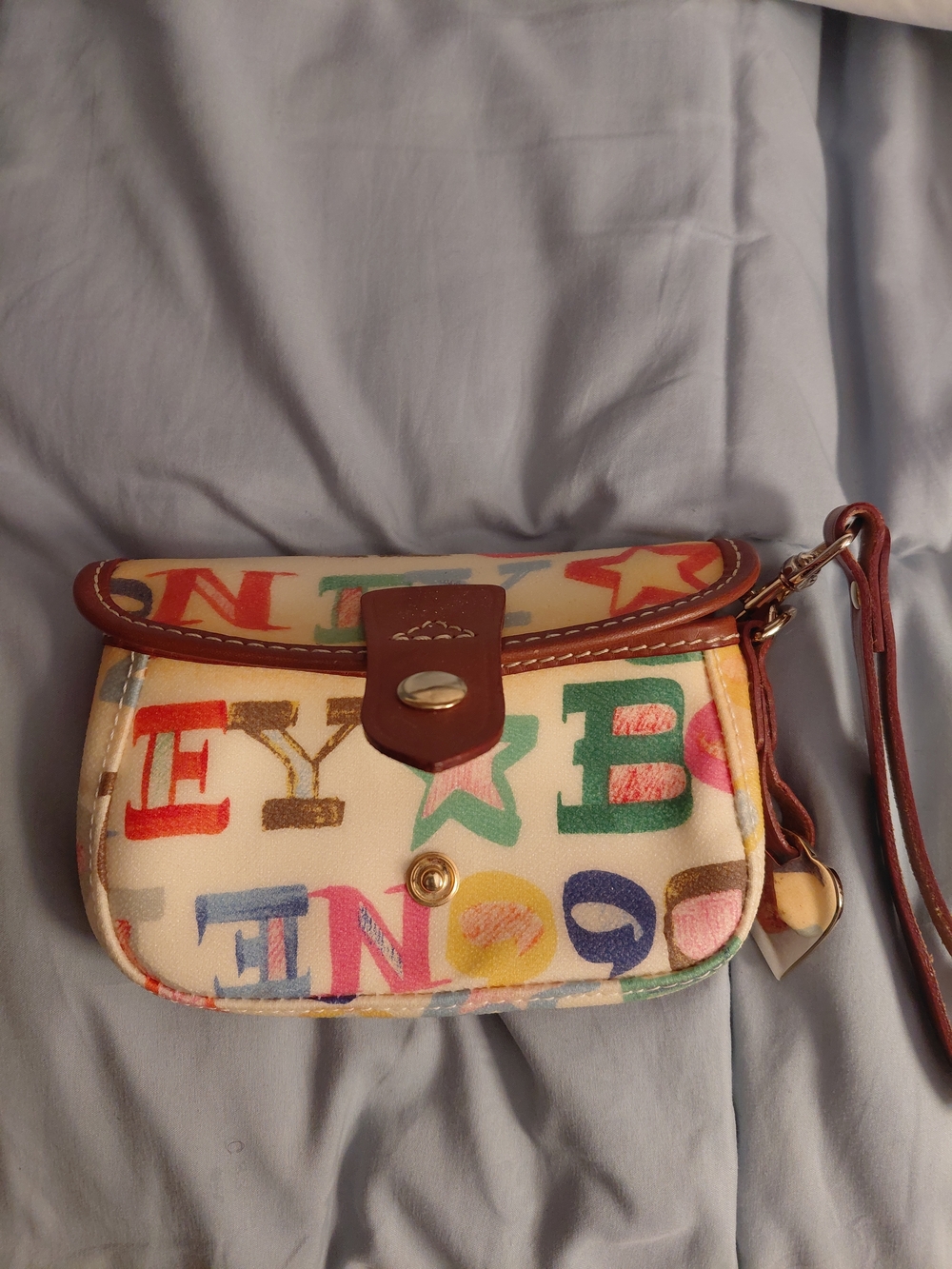 Dooney & Bourke Multicolor Letter Print Wristlet with Brown Trim